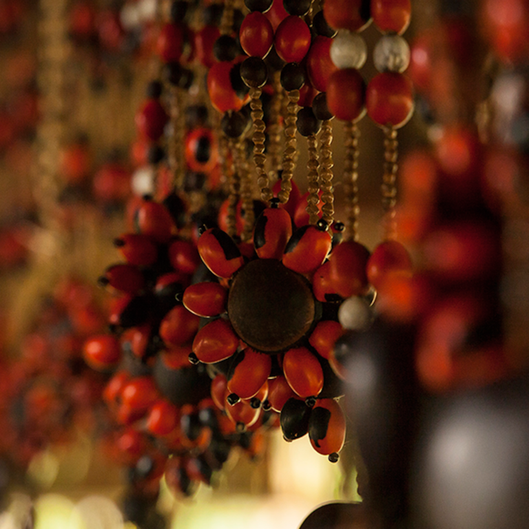 Red and brown beads hang from the ceiling.
